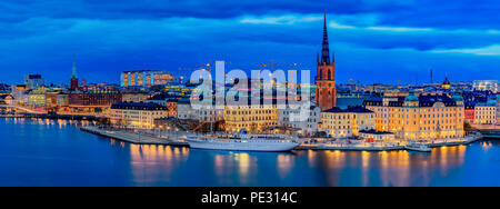 Stockholm, Sweden - October 24, 2017: Panoramic view across Lake Malaren at sunset onto traditional gothic buildings in old town, Gamla Stan and Ridda Stock Photo