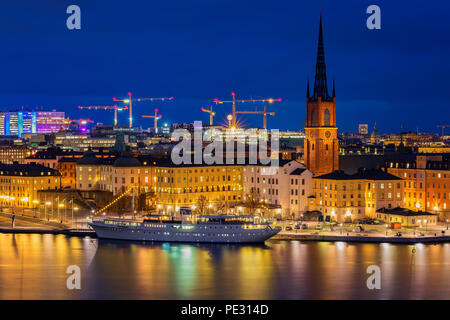 Stockholm, Sweden - October 24, 2017: View across Lake Malaren at sunset onto traditional gothic buildings in old town, Gamla Stan and Riddarholmen ch Stock Photo