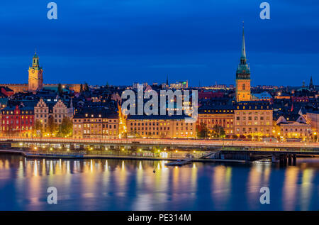 Stockholm, Sweden - October 24, 2017: Sunset view across Lake Malaren onto Storkyrkan or Stockholm Cathedral, German church and traditional gothic bui Stock Photo