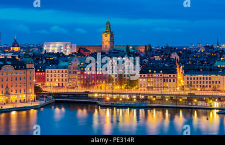 Stockholm, Sweden - October 24, 2017: Sunset view across Lake Malaren onto Storkyrkan or Stockholm Cathedral and traditional gothic buildings in the o Stock Photo