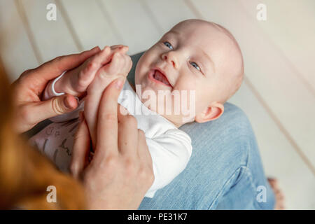 Nude mother breastfeeding infant son Stock Photo - Alamy
