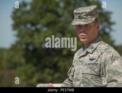 U.S. Air Force Col. Charles Brown, 19th Airlift Wing commander, expresses his appreciation for 19th Security Forces Squadron Defenders, Sept. 14, 2015, at Little Rock Air Force Base, Ark. Brown recognized two Defenders for their part in neutralizing a threat at the front gate on Vandenberg Drive, July 15, 2015. (U.S. Air Force photo by Senior Airman Scott Poe) Stock Photo