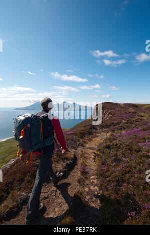 Hiker on Beinn Bhuidhe, Isle of Eigg Stock Photo
