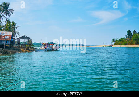 The coastal zone between Ngwesaung and Chaung Tha is full of narrow rivers, tributaries and creeks, so people use ferries or boats to travel along the Stock Photo