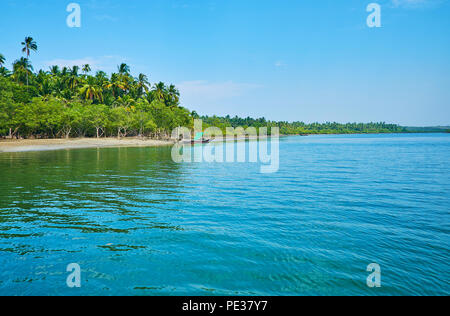 The joyful trip along Pathein river's tributary with a view on lush jungles, hiding small villages on coast of Bengal Bay, Thazin, Ngwesaung, Myanmar. Stock Photo