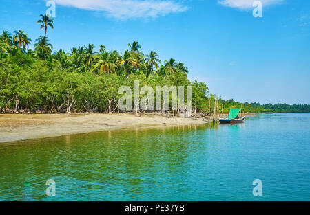 Enjoy untouched nature of Myanmar, traveling along the coast of Bay of Bengal and using the ferry to cross the numerous rivers and streams, Ngwesaung. Stock Photo