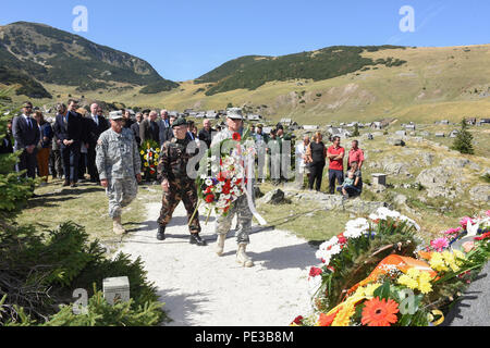 U.S. Army Brig. Gen. Giselle Wilz, NATO Headquarters Sarajevo commander, Command Sgt. Maj. Harley Schwind, NHQSa command senior enlisted leader and Col. Gyula Kovács, NHQSa chief of staff, paid respects during a memorial ceremony at Fojnica, Bosnia and Herzegovina Sept. 17, 2015.  On Sept. 17, 1997, 12 people were killed and four injured when a helicopter carrying a United States delegation slammed into a fog-shrouded Bosnian mountainside. (U.S. Air Force photo by Master Sgt. JT May III) Stock Photo