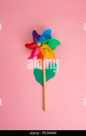 Colorful Pinwheel on pink paper Stock Photo