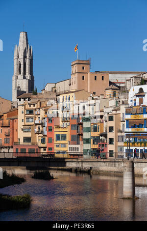 City of Girona in Catalonia, Spain, traditional houses in Old Town (Barri Vell), Pont de Sant Agusti bridge on Onyar River, skyline with Sant Feliu Ba Stock Photo