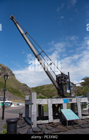 The lifting gear used to load and unload the boats in the square at Ellenabeich by the Isle of Seil in Argyle Scotland not far from Oban in the Highla Stock Photo