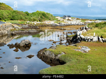 Quiet tidal creek on the island of Inis Ni near Roundstone in Connemara Ireland Stock Photo