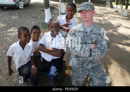 Pfc. Connor Paustian, an infantryman from USNS Comfort (T-AH-20), interacts with students from Jose Cecilio del Valle School in Santa Rosa de Agaun, Honduras, during a community relations event supporting Operation Continuing Promise on Sept. 2, 2015. Operation Continuing Promise is a mission in which the United States military works with host nations to provide humanitarian assistance and execute civil-military operations alongside various partner nations within the Caribbean and Central and South America. (U.S. Marine Corps photo by Cpl. Kirstin Merrimarahajara/released) Stock Photo