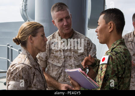 Brigadier Gen. Helen Pratt (left), commanding general of Force Headquarters Group, Marine Forces Reserve, and Sergeant Maj. William Grigsby (middle), sergeant major of FHG, MARFORRES, speaks with  Maj. Toshinori Ushida (right), a liaison officer with the Japanese Ground Self-Defense Force,  aboard the amphibious assault ship USS Boxer (LHD 4) during Exercise Dawn Blitz 2015, Sept. 4, 2015. Dawn Blitz is a scenario-driven exercise designed to train the U.S. Navy and Marine Corps in amphibious operations while building U.S. and coalition interoperability. (U.S. Marine Corps photo by Lance Cpl. A