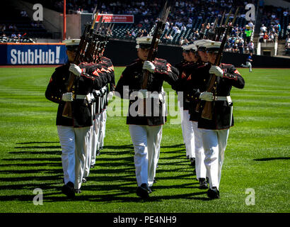 The Marine Corps Silent Drill Platoon marches off the field after their performance at Citi Field in Flushing, N.Y., Sept. 19, 2015. Members of the unit are selected for a two-year tour, performing for large audiences and influential individuals to include the President of the United States. The platoon is based out of Marine Barracks Washington, D.C.  (U.S. Marine Corps Photo by Sgt. Zachary W. Scanlon/Released) Stock Photo