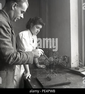 1950s, historical, young adult science undergraduates using microscopes ...