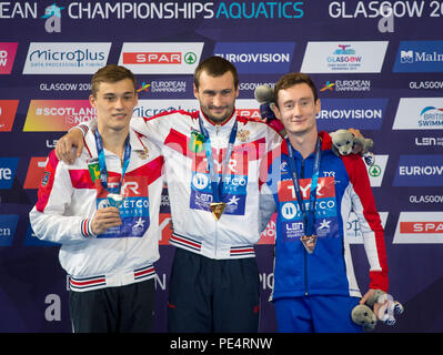 Men's 10m Platform Final medal presentation (from left to right) Russia's Nikita Shleikher (silver) Russia's Aleksandr Bondar (gold) and France's Benjamin Auffret (bronze) during day eleven of the 2018 European Championships at the Royal Commonwealth Pool, Edinburgh. Stock Photo
