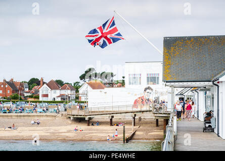 The pier at Southwold, Suffolk, looking back towards a mural depicting the author George Orwell (Eric Arthur Blair) by the artist Pure Evil Stock Photo