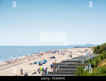 View from Southwold to Sizewell B, including beach huts and sand Stock Photo