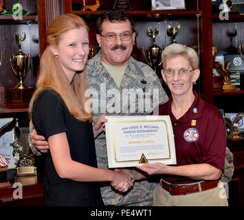 Bethany Lovell, left, is presented the Command Sgt. Maj. Virgil R. Williams Enlisted Association of the National Guard of the United States (EANGUS) Scholarship Award by Nancy J. Waller, Enlisted National Guard Association of Alabama (ENGAA) secretary treasurer, right, Sept. 20, 2015, at Birmingham Air National Guard Base, Birmingham, Ala. The national scholarship awards $2,000 toward education costs and is available to all dependents of sponsors who are members of EANGUS. She was chosen by a committee of educators and competed against 26 other applicants. Bethany is the daughter of Master Sgt Stock Photo