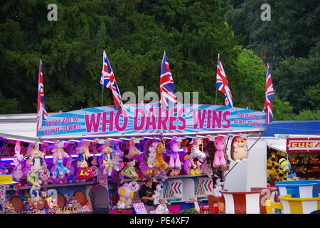 Union Jack Flags Flying on a Carnival Stall, Who Dares Wins. Bristol Balloon Fiesta, UK. August, 2018. Stock Photo