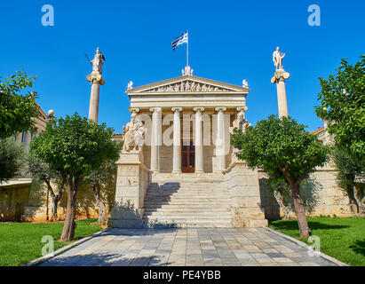 Principal facade of The Academy of Athens, Greece National academy, flanked by Athena and Apollo pillars and Plato and Socrates statues. Athens, Attic Stock Photo