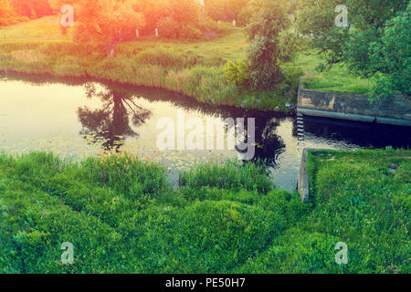 View of the countryside and river in the evening Stock Photo