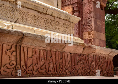 Quranic verses carved at the base of the tomb where the king Iltutmish was buried at Qutub minar complex in dehli India. Qutub Minar standing 73 meters high at Delhi, is the tallest brick minaret and UNESCO heritage site. It represents Indo -Islamic architectural style, built by Qutb-ud-Din Aibak as a victory Tower in 1192 A.D. Stock Photo