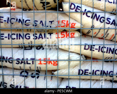 de-icing rock salt 15 kilogram bags in cage Stock Photo