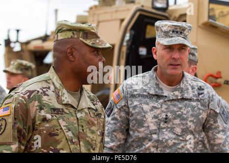 Maj. Gen. Stephen M. Twitty, Commanding General, 1st Armored Division and Fort Bliss, and Lt. Gen. Joseph Anderson, Department of the Army Deputy Chief of Staff, G-3/5/7, walk around the division tactical command post during Network Integration Evaluation 16.1, Oct. 6, 2015, Fort Bliss, Texas. NIE 16.1 will focus on future force development, training readiness and multinational interoperability with participants from 13 nations, over 10,000 service members and 3,000 civilians. (U.S. Army photo by: Sgt. Maricris C. McLane) Stock Photo