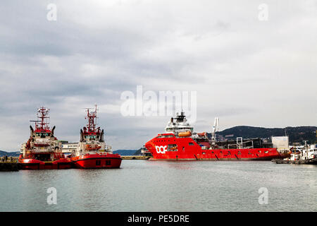 Offshore supply ships and tugs berthed in the port of Bergen, Norway. Skandi Vega (b.2010), Boxer (b.1999) and  BB Worker (b.2007). Veteran tug boat V Stock Photo