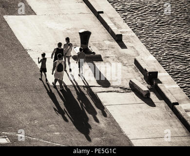abstract very long shadows silhouettes of two people on the ground ...