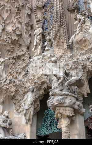 Sagrada Familia exterior - The central image of the Nativity facade focuses on Mary and Joseph with newborn Jesus in the manger. Angels sing and play  Stock Photo