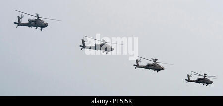 151103-N-CJ186-153 ARABIAN GULF (Nov. 3, 2015) Two AH-64D Apache helicopters, assigned to U.S. Army Charlie Troop Heavy Cav, and two Kuwaiti Apache helicopters fly together during a bi-lateral training exercise in the Arabian Gulf. The combined-joint exercise provided U.S. forces, which also included U.S. Coast Guard and U.S. Navy, an opportunity to exchange tactics and best practices with Kuwait naval forces. CTG 56.7 conducts maritime security operations to ensure freedom of movement for strategic shipping and naval vessels operating in the inshore and coastal areas of the U.S. 5th Fleet are Stock Photo