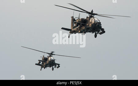 151103-N-CJ186-929 ARABIAN GULF (Nov. 3, 2015) Two AH-64D Apache helicopters, assigned to U.S. Army Charlie Troop Heavy Cav, fly together during a bi-lateral training exercise in the Arabian Gulf. The combined-joint exercise provided U.S. Forces, U.S. Coast Guard and U.S. Navy, an opportunity to exchange tactics and best practices with Kuwait naval forces. CTG 56.7 conducts maritime security operations to ensure freedom of movement for strategic shipping and naval vessels operating in the inshore and coastal areas of the U.S. 5th Fleet area of operations. (U.S. Navy photo by Mass Communication Stock Photo