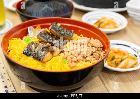 Box of grilled Saba fish, omelette, salad, garlic fried rice and kimchi - easy meal with healthy food Stock Photo