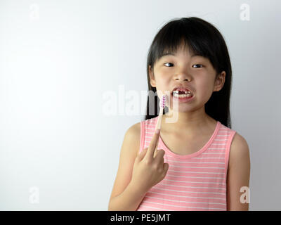 Little girl without front teeth with tooth brush Stock Photo