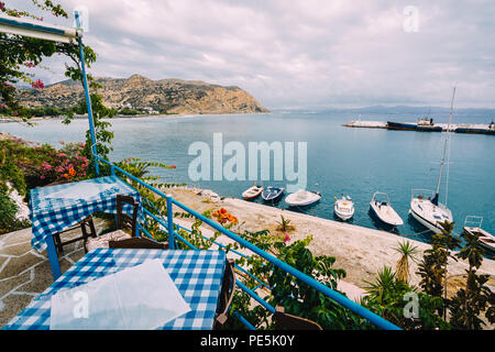 Crete, Creece, August 2018: View from the Restaurant Zorbas Beach and Bar in Kokkini Hani, Crete with a nice view over the harbour and boats. Photo ta Stock Photo