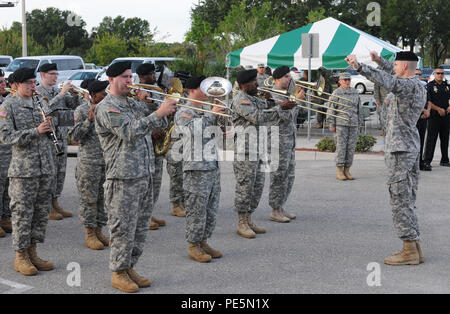 The 313th Army Reserve Band out of Birmingham, Ala., plays the Army Song during the Army Reserve Medical Command Change of Command Ceremony held Sept. 26, 2015, at the C.W. Bill Young Armed Forces Reserve Center in Pinellas Park, Fla. During the ceremony, the incoming command team Maj. Gen. Mary E. Link and Command Sgt. Maj. Marlo V. Cross, assumed command and responsibility respectively from Maj. Gen. Bryan R. Kelly and Command Sgt. Maj. Harold P. Estabrooks, the outgoing command team. Stock Photo