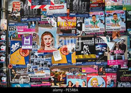 Posters stuck on the window of an empty shop advertising shows on the Edinburgh Fringe Festival, Edinburgh, Scotland, UK. Stock Photo