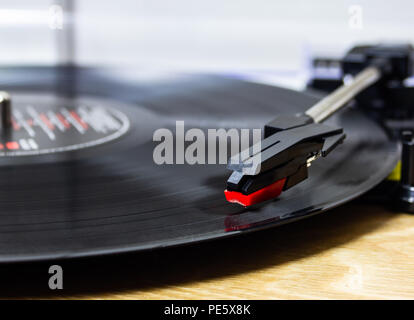 Playing a vinyl record on a record player Stock Photo
