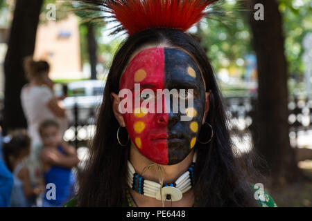 Moscow, Russia, Sunday, August 12, 2018.The Eights International history festival 'Times & Epochs' starts in Moscow. The exhibition period is August 10-22. The venue for the festival is Boulevard Ring (9 km or 6 mi long). Historical periods and events from the Stone Age to the end of the XX century are presented by international teams at 30 locations. Native American warrior of the Sioux tribe in war paint. Credit: Alex's Pictures/Alamy Live News Stock Photo