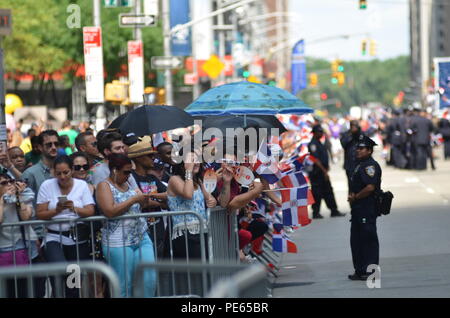 New York, USA. 12th Aug, 2018. People attend the Dominican Day Parade in New York, the United States. Dominican Day is a festive occasion celebrating Dominican tradition, heritage and folklore in the streets of New York. Credit: Ryan Rahman/Alamy Live News Stock Photo