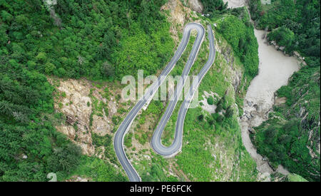 (180813) -- GYIRONG, Aug. 13, 2018 (Xinhua) -- Aerial photo taken on Aug. 12, 2018 shows a winding mountain road of the Gyirong Pass highway in Gyirong County of Xigaze City, southwest China's Tibet Autonomous Region. The Gyirong Pass highway, a 94-kilometer section of the National Highway 216, is an important trade route connecting China and Nepal. The road was heavily affected by the devastating earthquake in Nepal in April 2015. Now the road has resumed vitality and taken a new look after years of repairing and renovation, while annual trade volume of Gyirong Port almost grew seven-fold fro Stock Photo