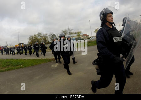 Members of the Kosovo Police rush toward the scene of a simulated violent demonstration as they prepare to conduct a crowd and riot control mission during Operation Stonewall, Oct. 16, 2015, outside the Bill Clinton Sports Center in Ferizaj, Kosovo. Operation Stonewall was a combined emergency response training event, which incorporated a crowd riot control situation, held by the Kosovo Police and NATO’s Kosovo Force soldiers assigned to Multinational Battle Group-East. The exercise incorporated more than 350 personnel from across several agencies—including Turkish soldiers from MNBG-E—as a wa Stock Photo