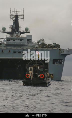 A British amphibious craft transports U.S. Marines with Special-Purpose Marine Air-Ground Task Force Crisis Response-Africa and Royal Marines with 45 Commando to the HMS Ocean in the Mediterranean Sea during Trident Juncture 15, Oct. 21, 2015. Trident Juncture is one of many exercises ensuring that NATO is ready to deal with any emerging crisis from any direction, and that the Alliance is able to work effectively with partner nations. Stock Photo