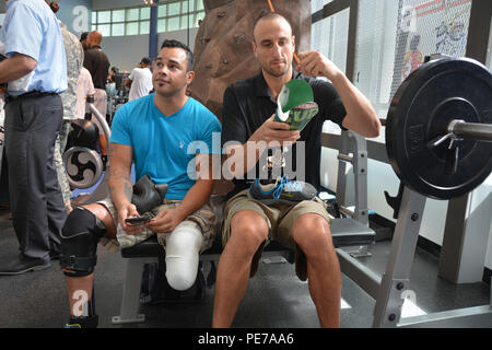 San Antonio Spurs guard Manu Ginobili signed Joel Ramos prosthetic leg at the Center for the Intrepid Oct. 21. The Spurs visited warriors and family members at the Warrior and Family Support Center and the CFI. Players signed autographs and participated in a game of wheelchair basketball. (U.S. Army photo by Robert T. Shields/Released) Stock Photo