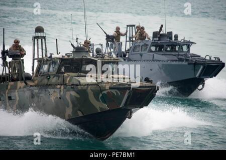 151103-N-CJ186-834 ARABIAN GULF (Nov. 3, 2015) Commander, Task Group (CTG) 56.7’s Riverine Command Boats (RCB) 802 and 805 participate in a bilateral exercise with Kuwait naval forces in the Arabian Gulf. The combined-joint exercise provided U.S. forces, which also included U.S. Coast Guard and U.S. Army, an opportunity to exchange tactics and best practices with Kuwait naval forces. CTG 56.7 conducts maritime security operations to ensure freedom of movement for strategic shipping and naval vessels operating in the inshore and coastal areas of the U.S. 5th Fleet area of operations. (U.S. Navy Stock Photo