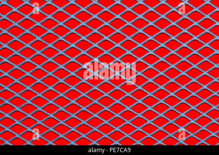 Metallic mesh grid on a red background Stock Photo
