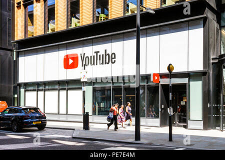 Three women walking past he YouTube Space building in Pancras Road, King's Cross, London, UK Stock Photo