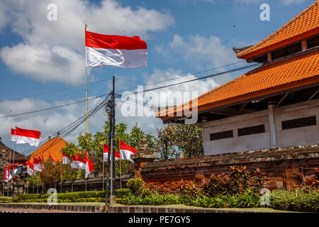 Flags at the streets of Bali before celebration on Indonesian Independence day. Bali, Indonesia Stock Photo